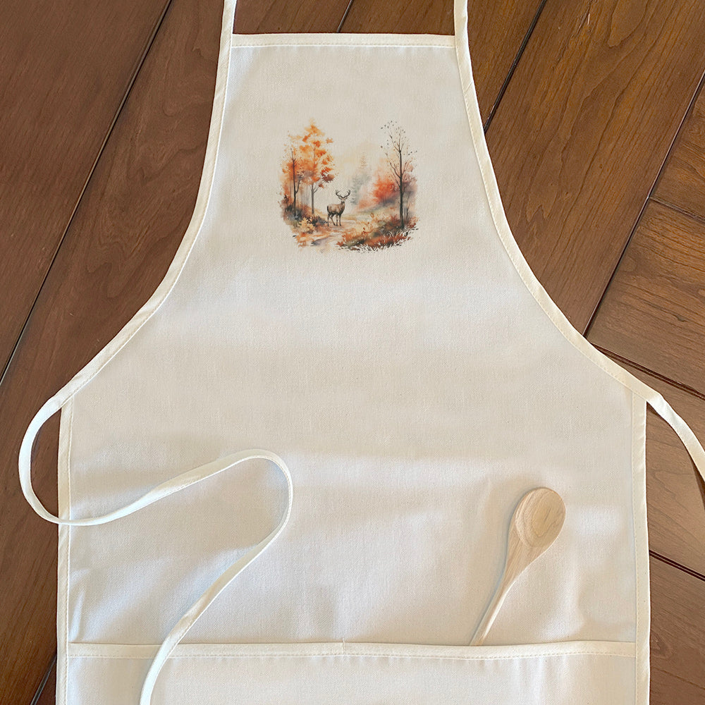 A stylish women's apron featuring a watercolor design of a fall forest with deer, made from durable cotton canvas.