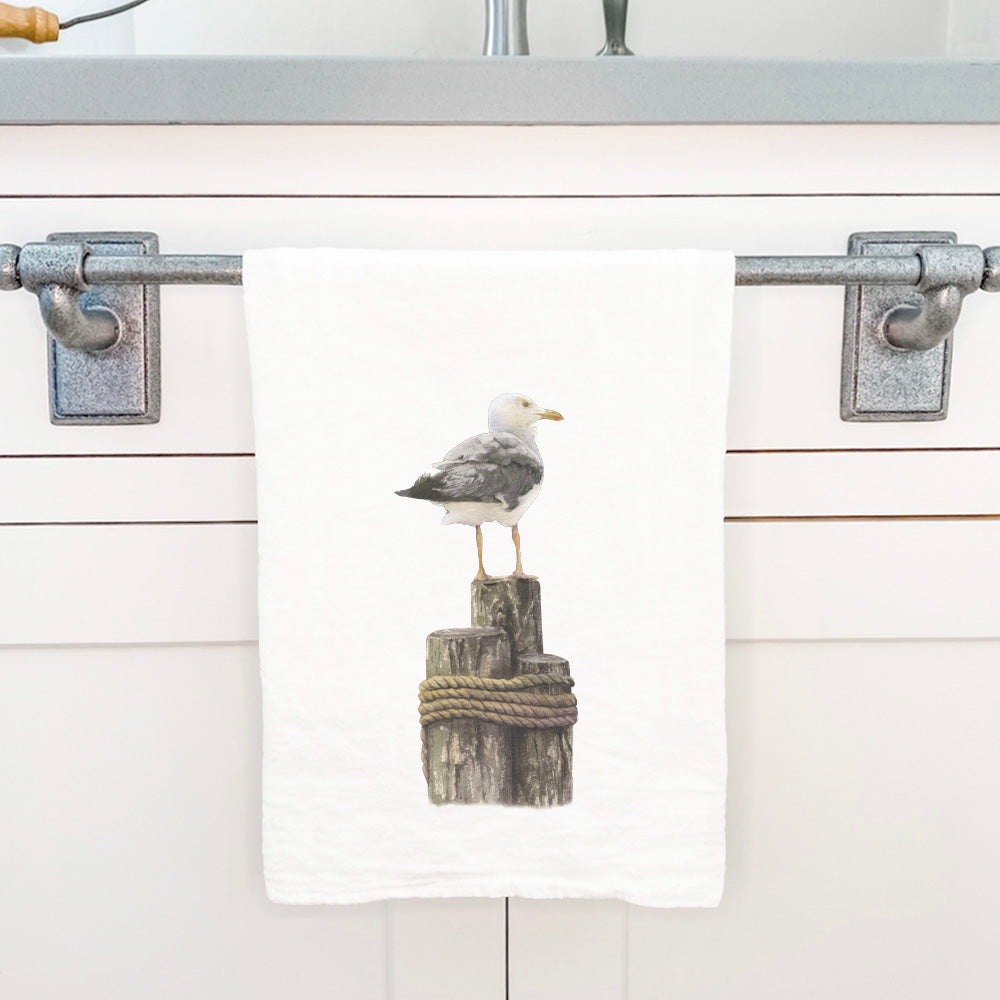 A vibrant watercolor seagull design on a 100% cotton tea towel, showcasing its absorbent and durable flour sack style.