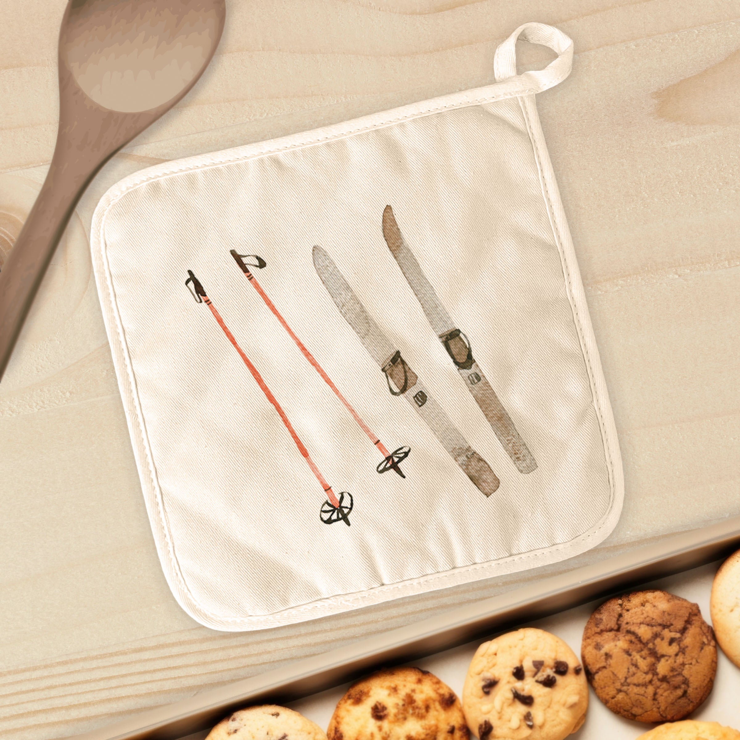 A vibrant Watercolor Skis cotton pot holder featuring a colorful ski design, perfect for protecting surfaces from hot cookware.