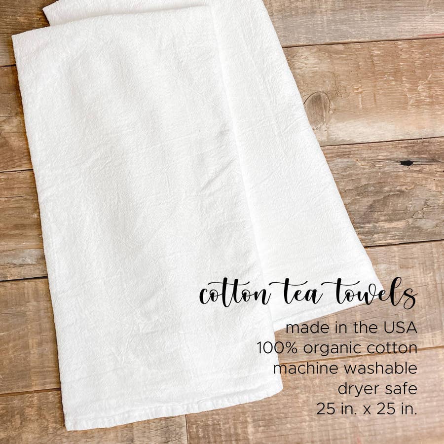 We Live for Adventure cotton tea towel featuring a vibrant design, perfect for kitchen use and decor.