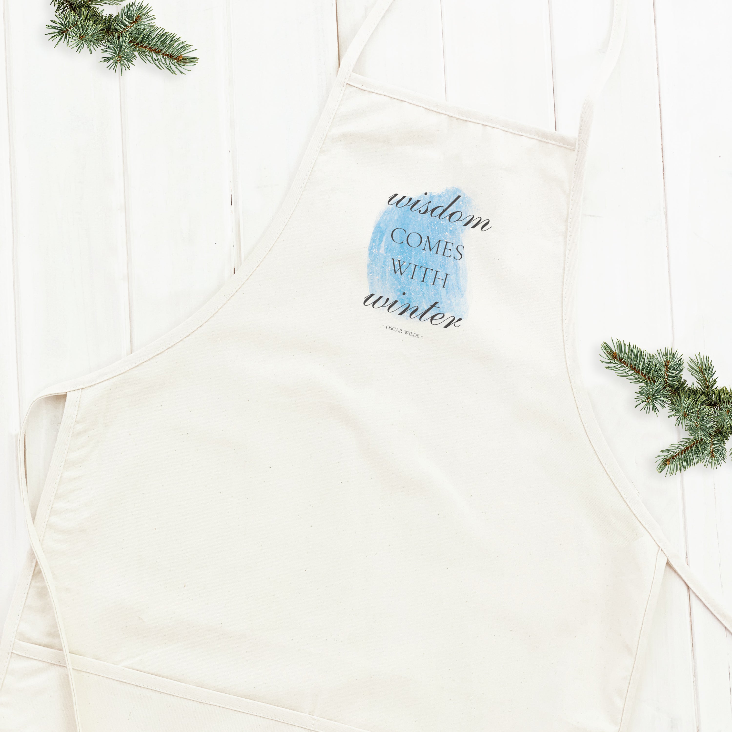 Winter Wisdom Women's Apron made of cotton canvas with natural twill ties and a divided front pocket, featuring elegant design and eco-friendly prints.