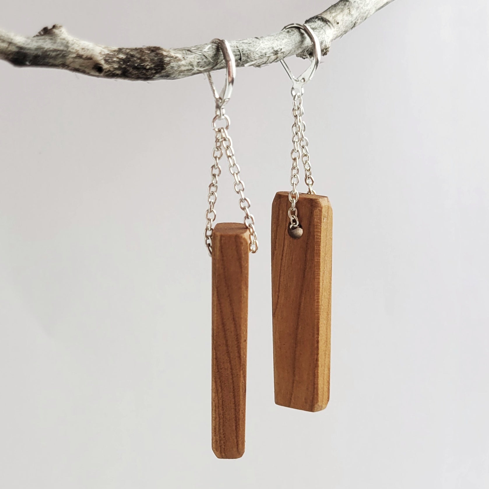 Handmade wooden rectangle bar earrings in cherry and walnut finishes with silver plated attachments and lever backed closure.