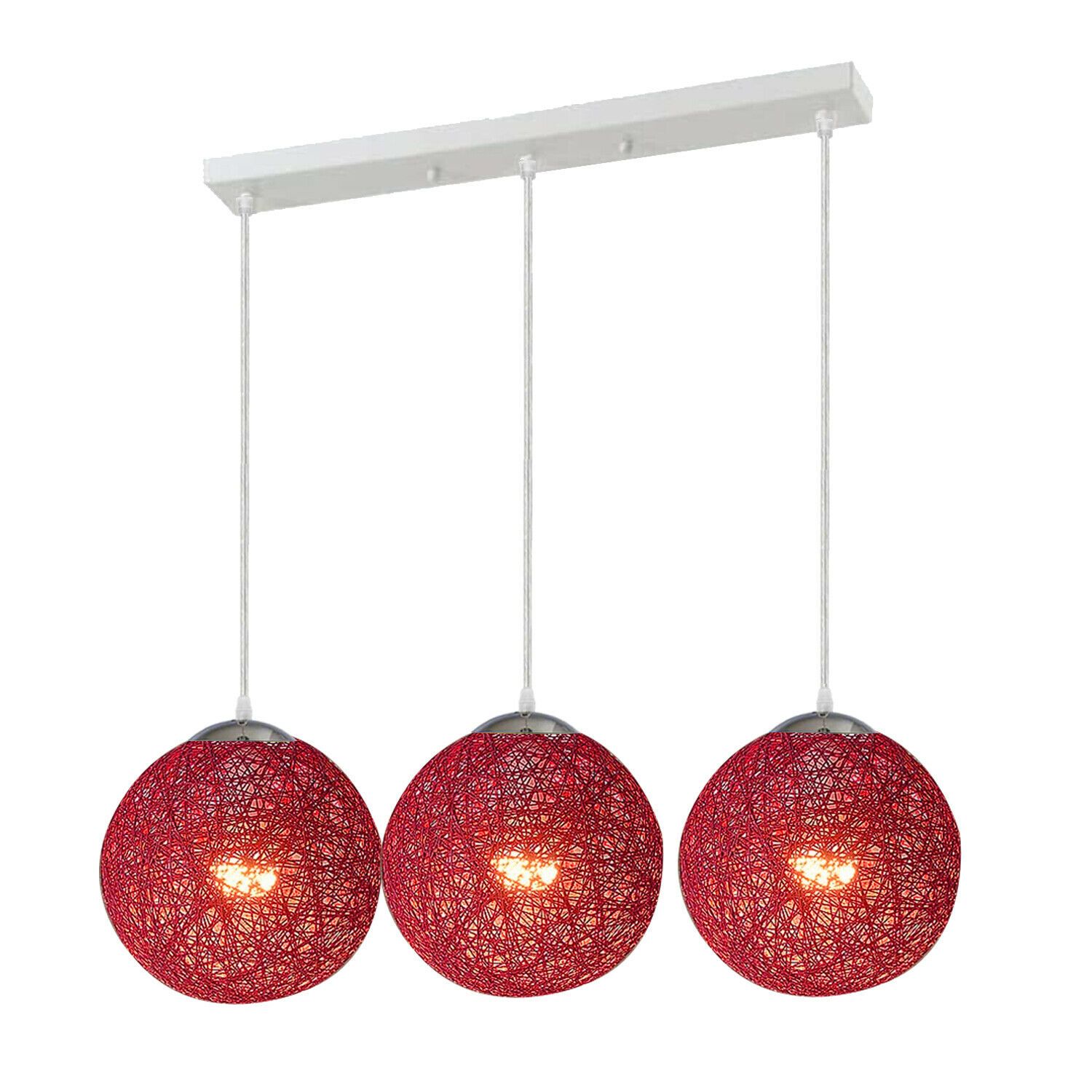 Three red rattan pendant lights hanging elegantly, showcasing intricate wicker design and warm illumination.
