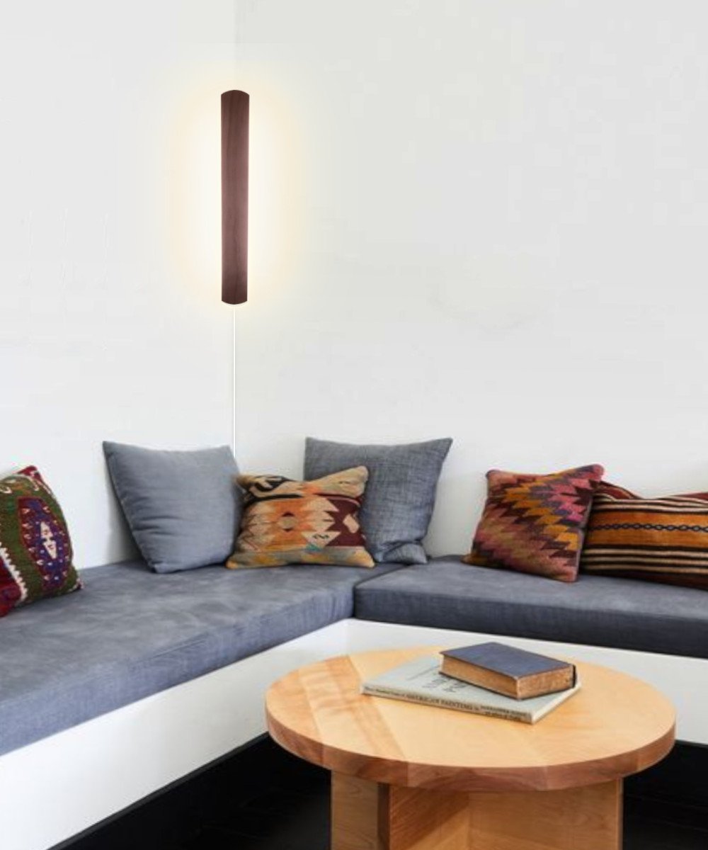 3-inch wide solid wood Hover Plank accent light, 24 inches tall, featuring a medium oak finish, designed for corner or wall installation with a dimmable LED.