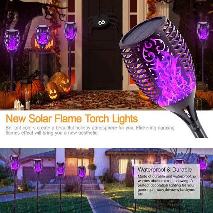 Four solar lights with flickering flame effect, designed for outdoor use, showcasing a romantic ambiance in a garden setting.