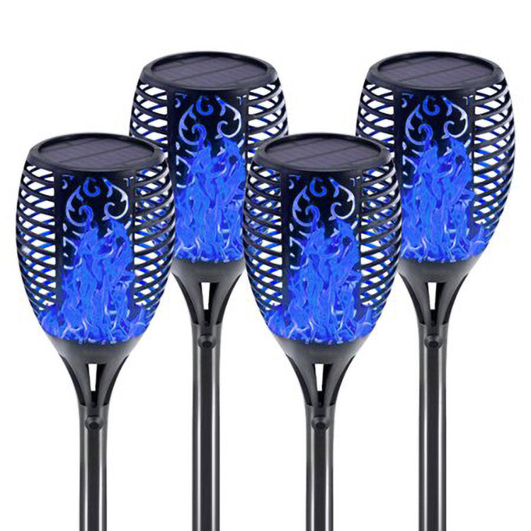 Four solar lights with flickering flame effect, designed for outdoor use, showcasing a romantic ambiance in a garden setting.
