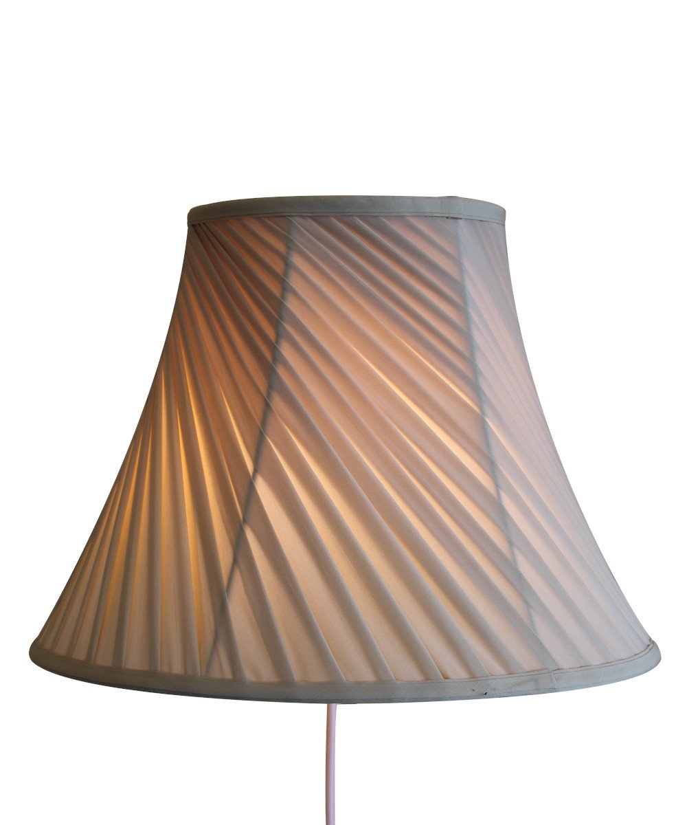 8-inch floating shade plug-in wall light with eggshell silk fabric, minimalist design, and rotary dimmer switch.