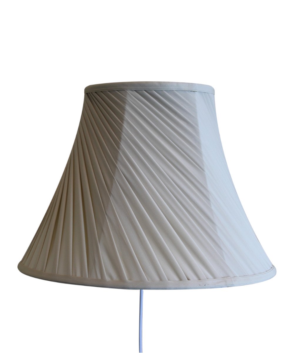 8-inch floating shade plug-in wall light with eggshell silk fabric, minimalist design, and rotary dimmer switch.
