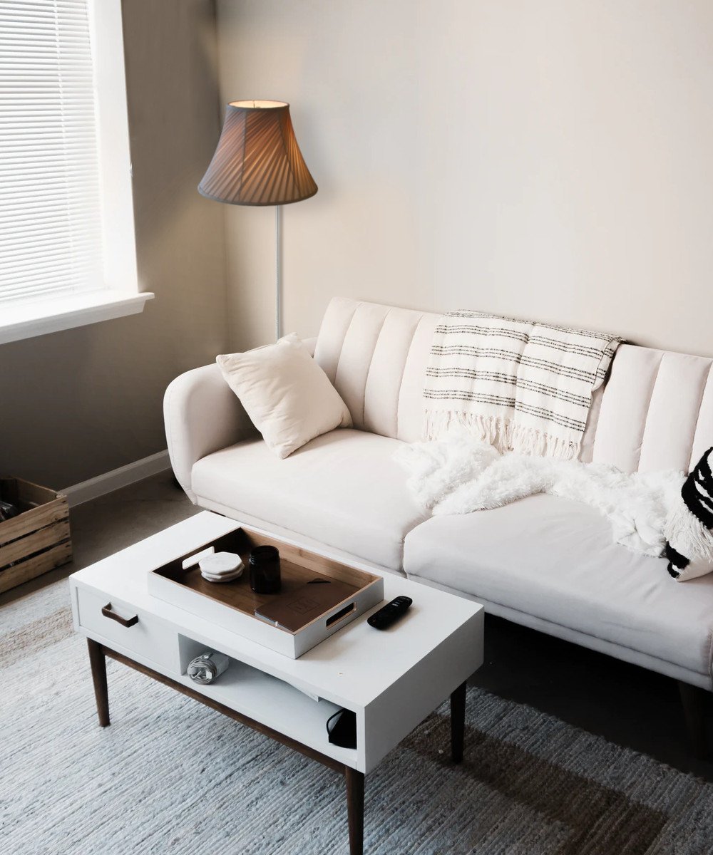 8-inch floating shade plug-in wall light with eggshell silk fabric, minimalist design, and rotary dimmer switch.