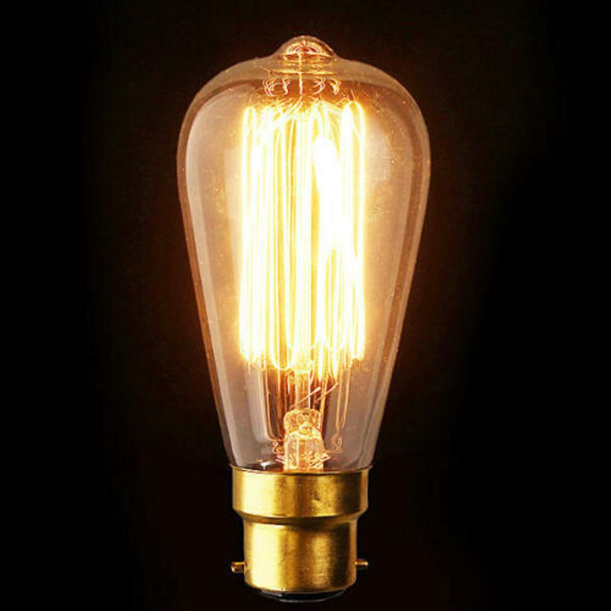 Edison Vintage Light Bulb with B22 bayonet fitting, showcasing a warm yellow glow and classic filament design.