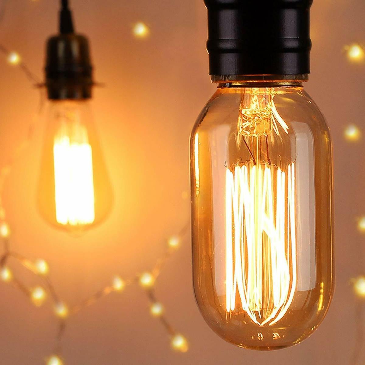 Edison Vintage Light Bulb with B22 bayonet fitting, showcasing a warm yellow glow and classic filament design.