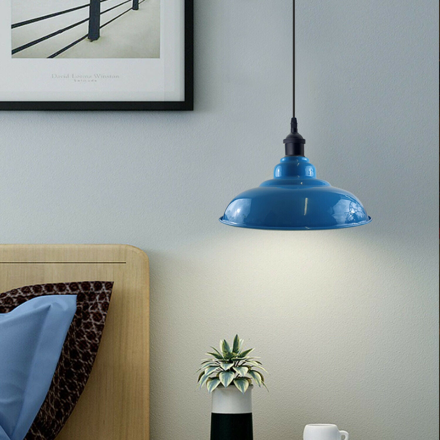 Stylish blue pendant light with a sleek dome design, perfect for kitchen islands and bar areas, featuring a white interior for enhanced illumination.