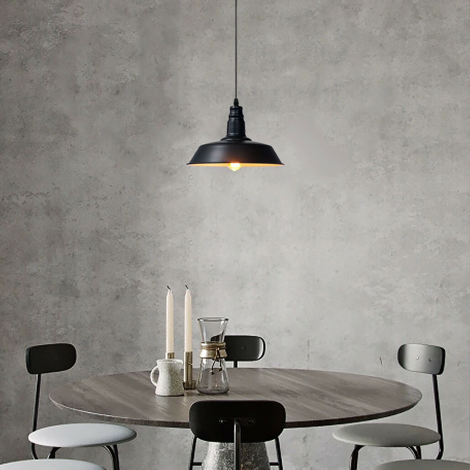 Ceiling pendant light with a sleek metal shade, ideal for indoor decoration, featuring an E27 lamp base and a stylish black finish.