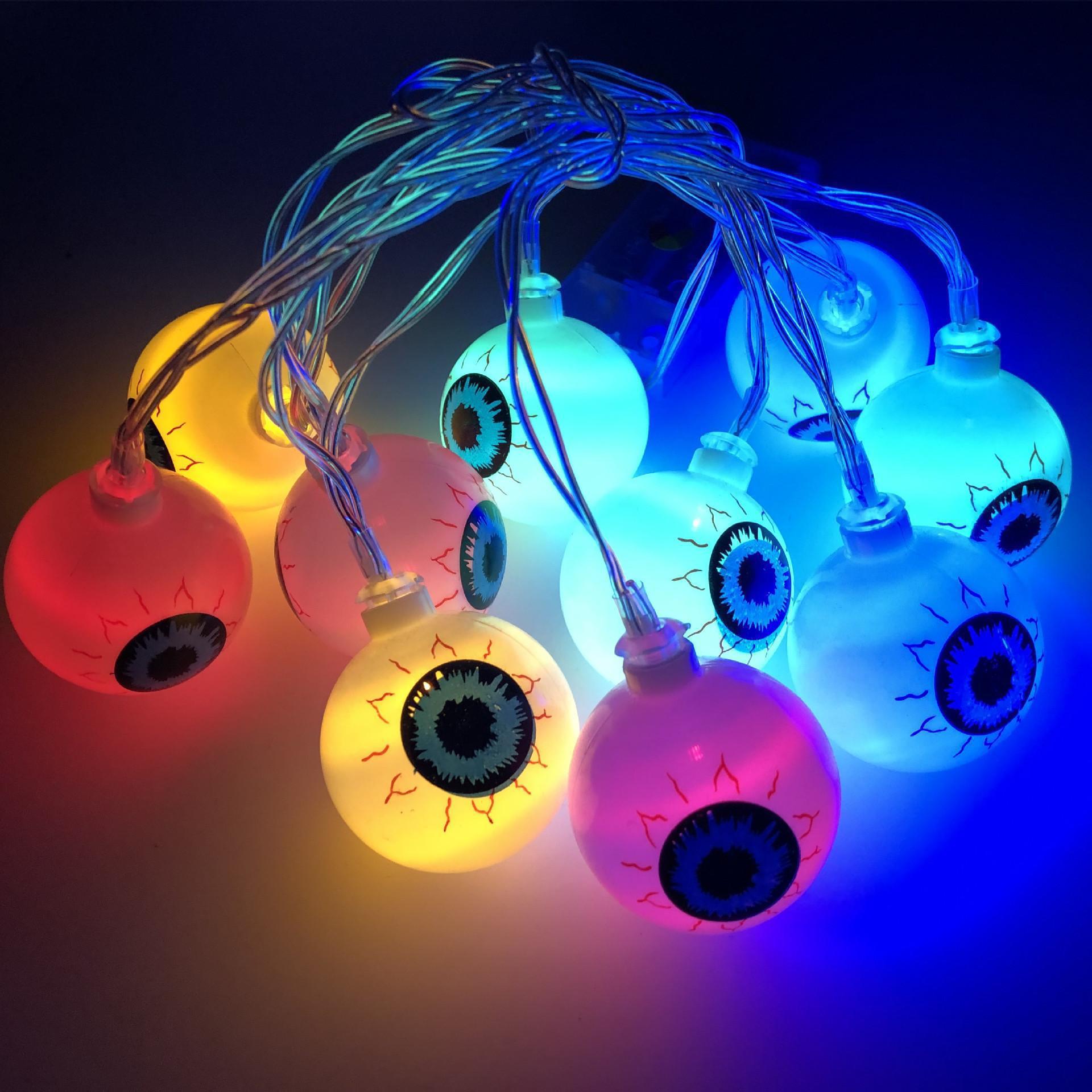 A string of 10 LED eyeball lights, perfect for Halloween decorations, featuring spooky eyeball designs in various colors.