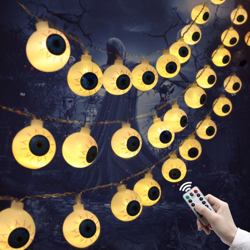 A string of 10 LED eyeball lights, perfect for Halloween decorations, featuring spooky eyeball designs in various colors.