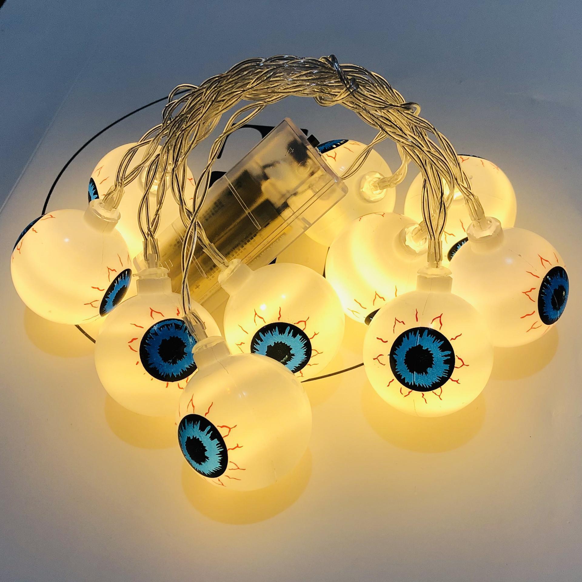 A string of 10 LED eyeball lights, perfect for Halloween decorations, featuring spooky eyeball designs in various colors.