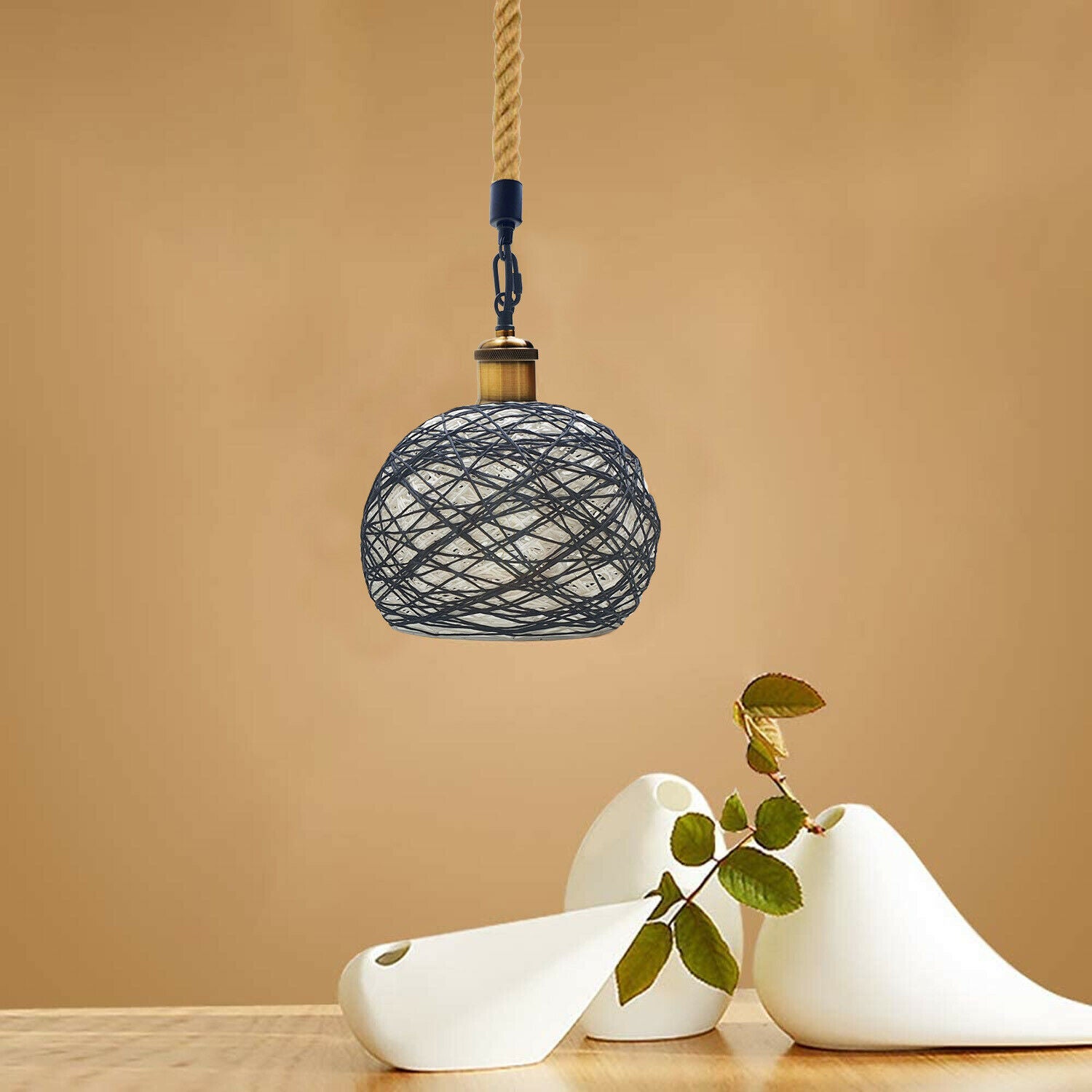 Industrial vintage pendant lamp made of rattan and metal with hemp rope, showcasing a rustic design suitable for home decor.