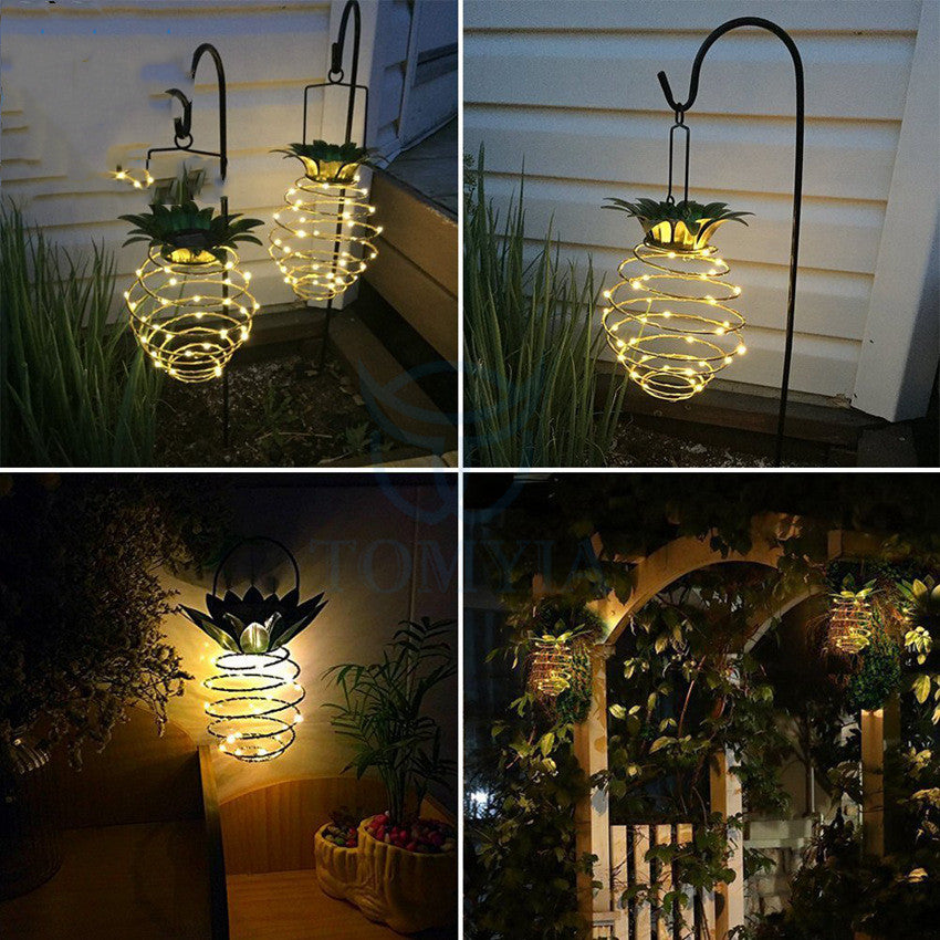 Outdoor Waterproof Garden Pineapple Solar Lights with warm white LED bulbs, perfect for garden decoration.