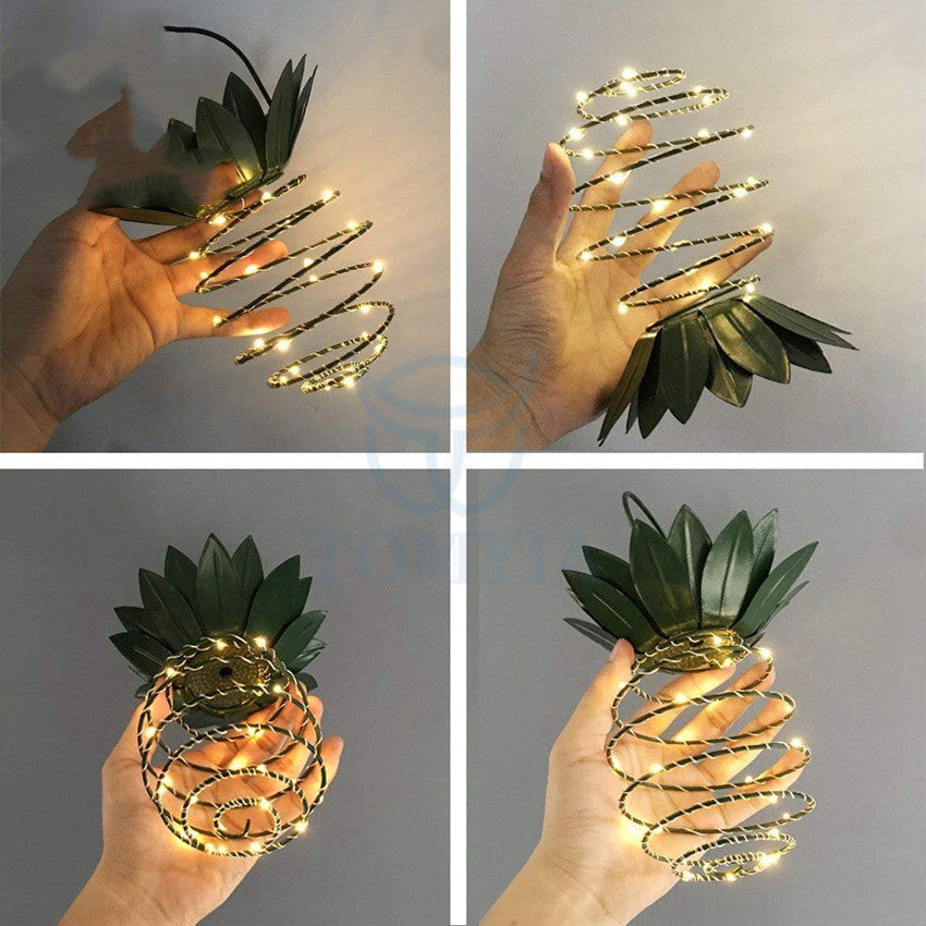 Outdoor Waterproof Garden Pineapple Solar Lights with warm white LED bulbs, perfect for garden decoration.