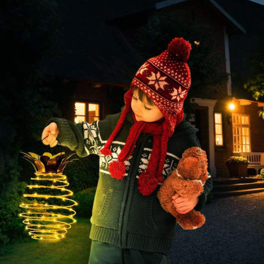 Outdoor Waterproof Garden Pineapple Solar Lights with warm white LED bulbs, perfect for garden decoration.