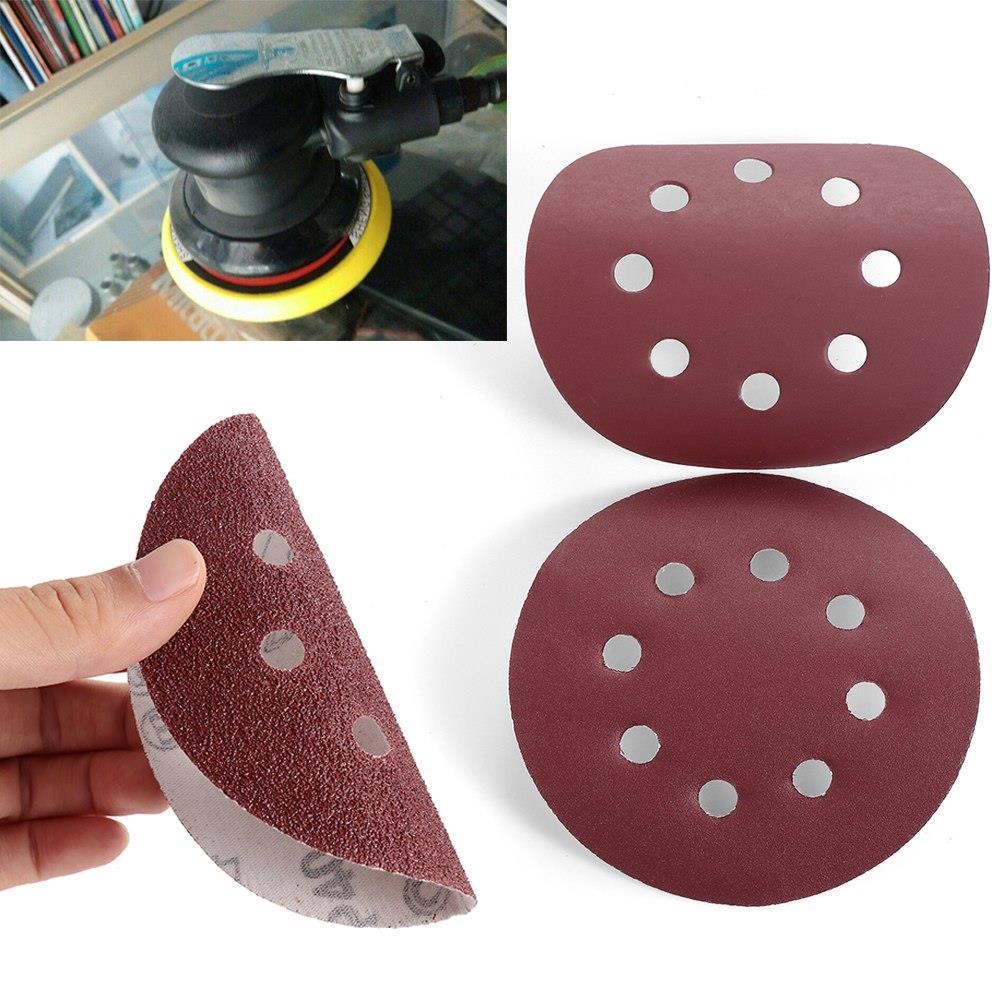 P-180 5 inch 8 Hole Sanding Discs made of aluminum oxide, ideal for polishing metal, wood, and jade, featuring a red color and 8 holes for dust extraction.