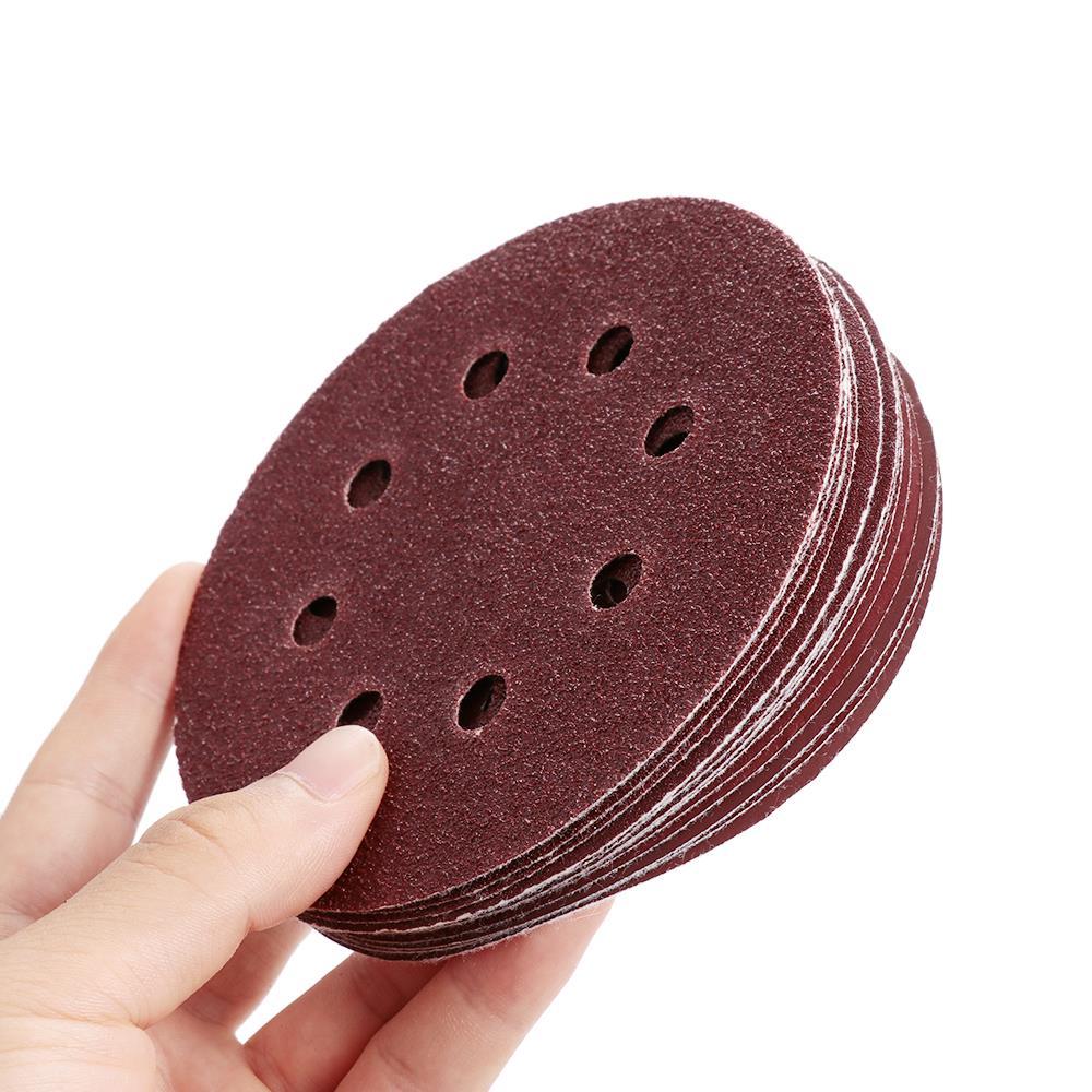 P-180 5 inch 8 Hole Sanding Discs made of aluminum oxide, ideal for polishing metal, wood, and jade, featuring a red color and 8 holes for dust extraction.