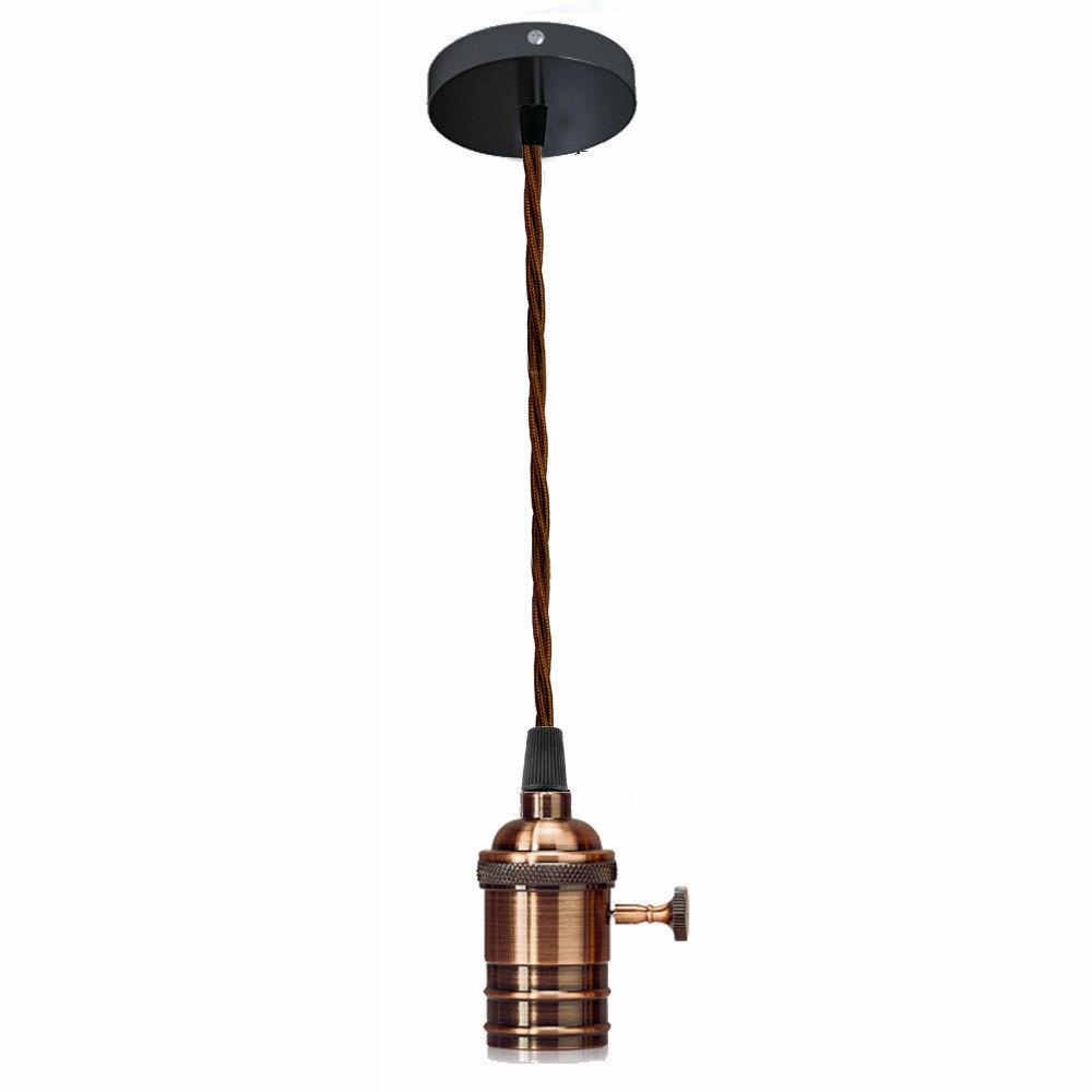 Copper pendant light with a ceiling canopy and fabric cord, showcasing a modern design suitable for various interiors.