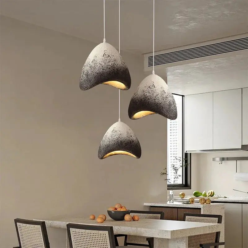 Elegant Raven Pendant Lights with black and white lampshade, perfect for modern decor.