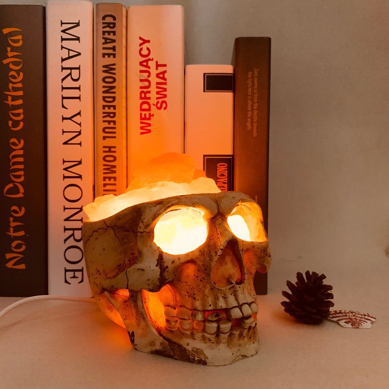A unique Skull Crystal Salt Lamp made from Himalayan salt, featuring a warm amber glow and USB power supply, perfect for mood lighting and air purification.