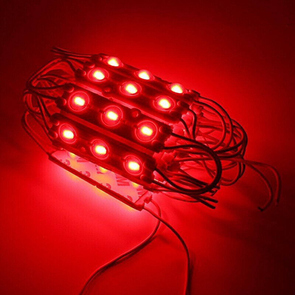 SMD LED Red Injection Module IP67 DC12V Strip with self-adhesive backing, showcasing its compact design and bright red illumination.