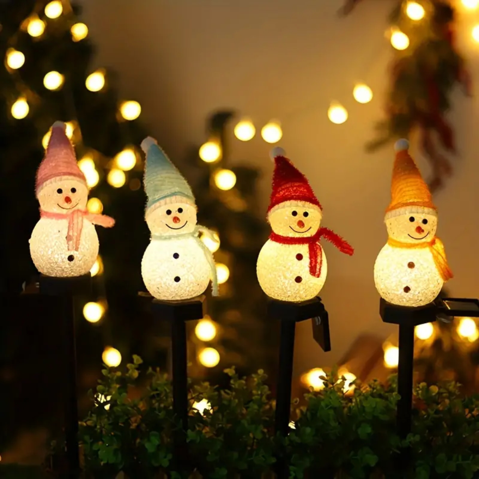 A charming solar-powered snowman decoration light for outdoor use, featuring a cute design and vibrant red color, perfect for festive occasions.