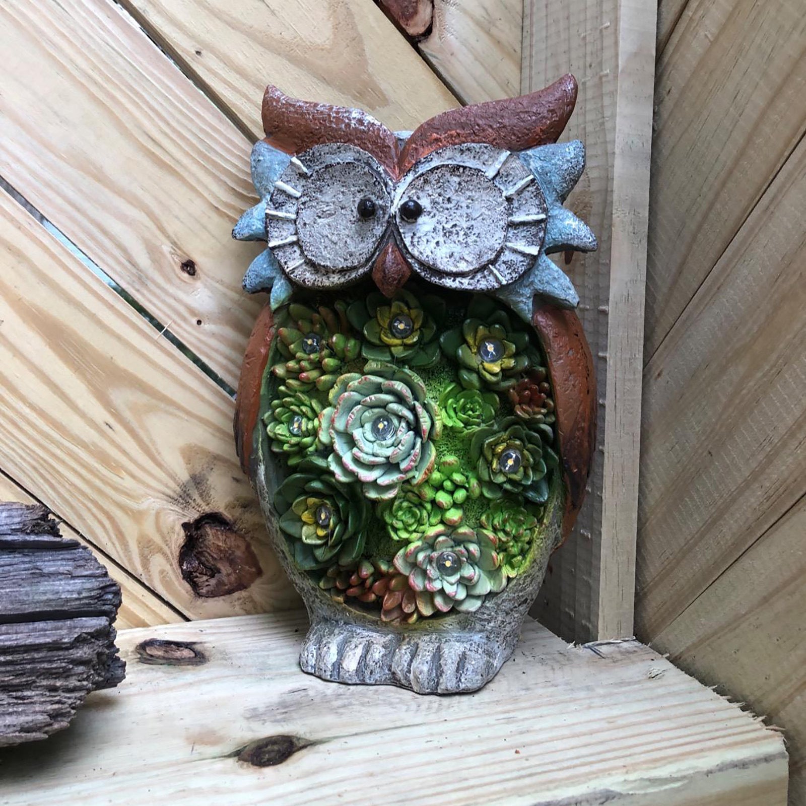 A charming Solar Owl LED Light made of durable resin, designed for outdoor decoration, showcasing its intricate owl design and solar panel.