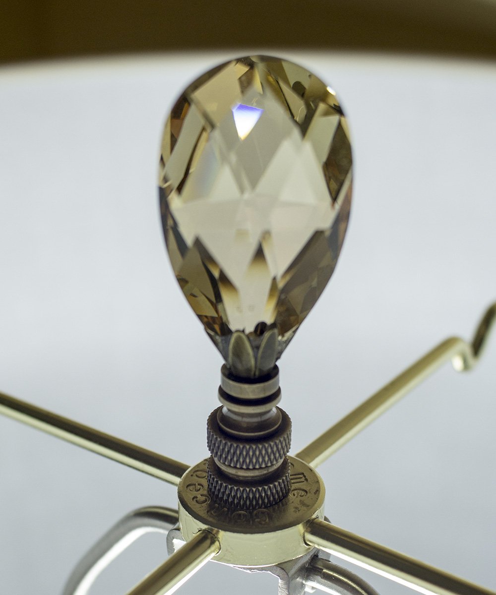 Stephanov Large Champagne Crystal Teardrops Lamp Finial in Antique Brass, showcasing a teardrop shape with a dusty rose hue and a classic brass base.