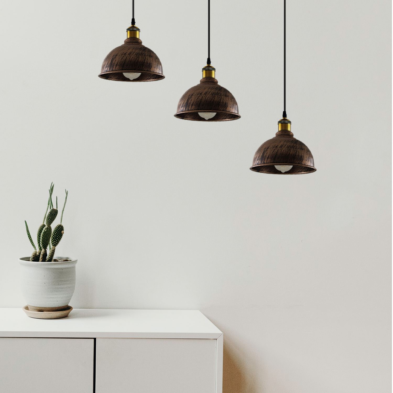 Vintage Industrial Brushed Copper Indoor Hanging Adjustable Pendant with three light shades and adjustable cables, showcasing its elegant design.