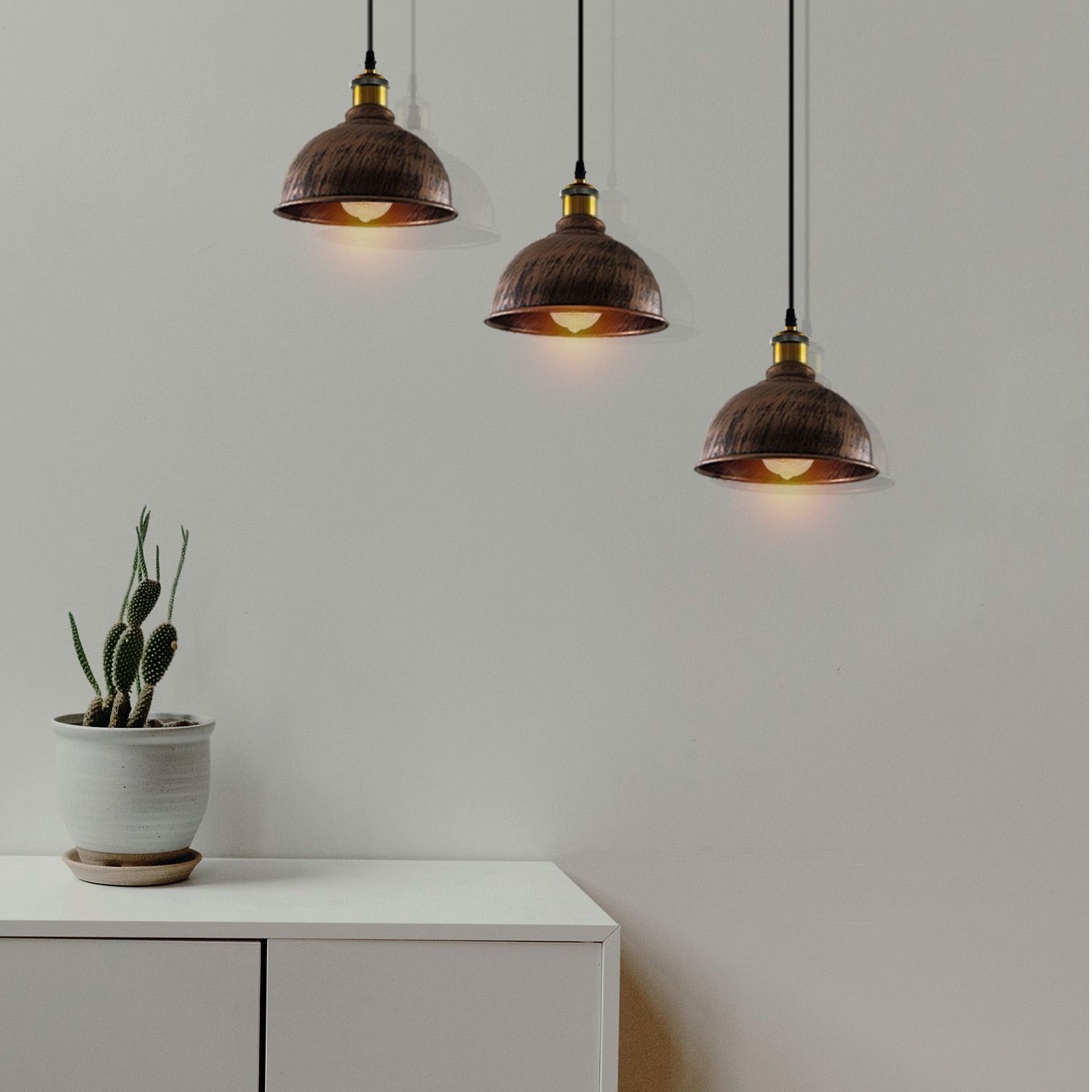 Vintage Industrial Brushed Copper Indoor Hanging Adjustable Pendant with three light shades and adjustable cables, showcasing its elegant design.