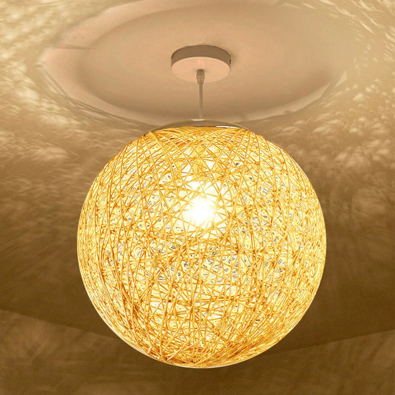 Yellow modern lattice wicker rattan globe ball style ceiling pendant light, showcasing its intricate design and warm glow.