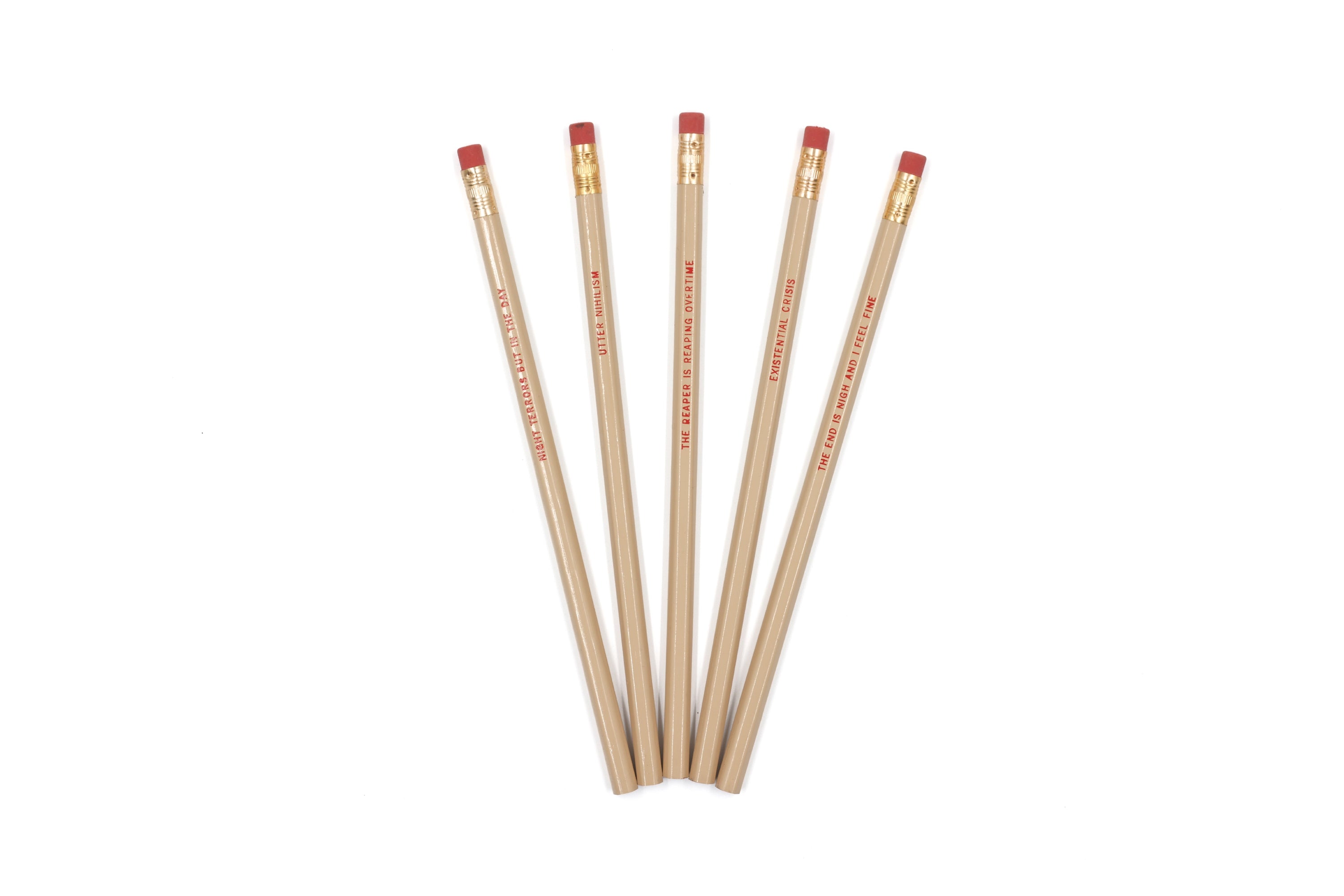 EXISTENTIAL CRISIS Pencil Set featuring five cedar pencils in cream color with blood-red stamped phrases and gold ferrules.