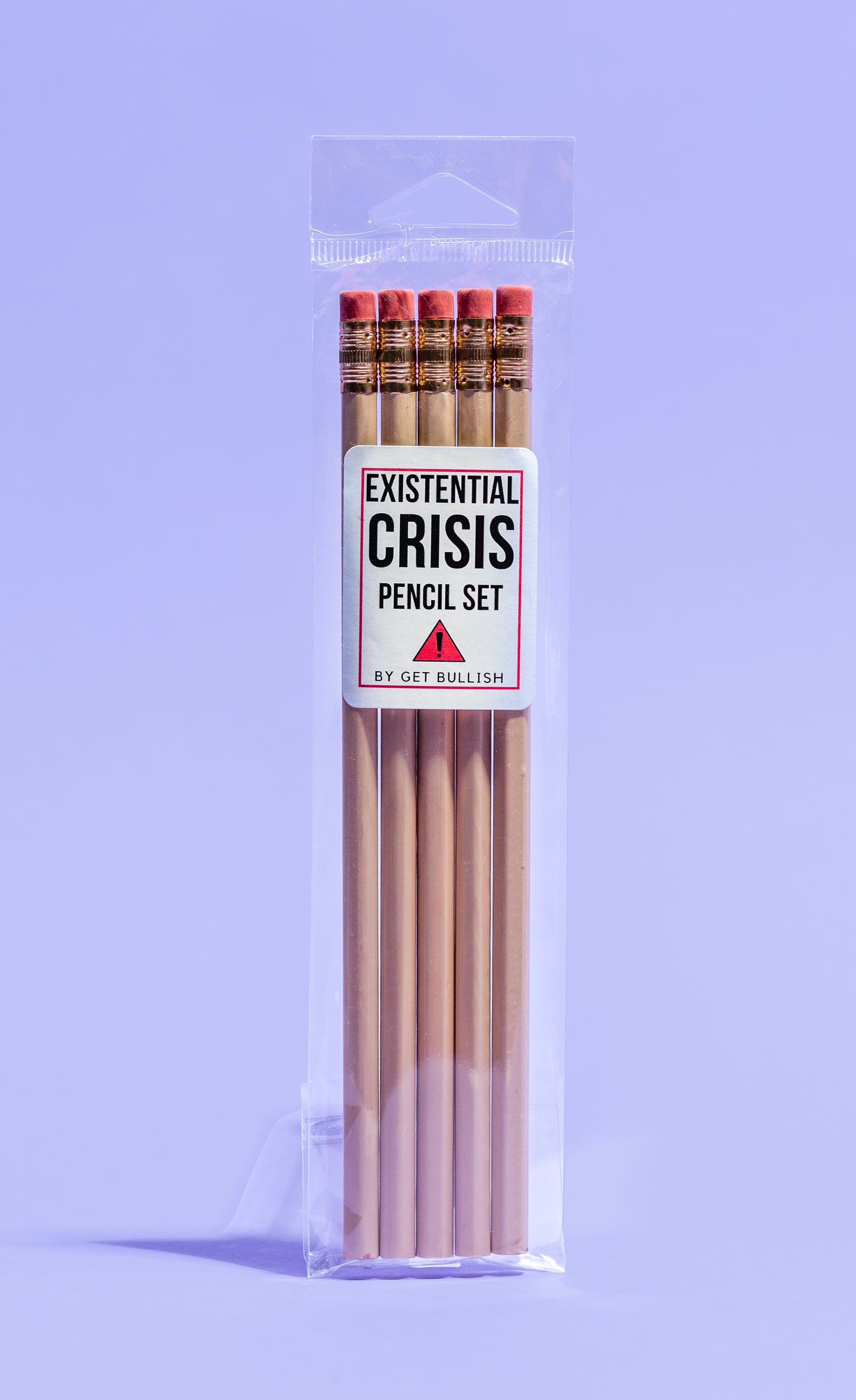 EXISTENTIAL CRISIS Pencil Set featuring five cedar pencils in cream color with blood-red stamped phrases and gold ferrules.