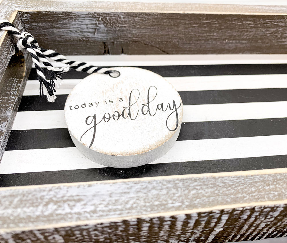 Good Day Stripes wooden tray featuring a black and white design with the phrase 'Today is a good day' on one side.