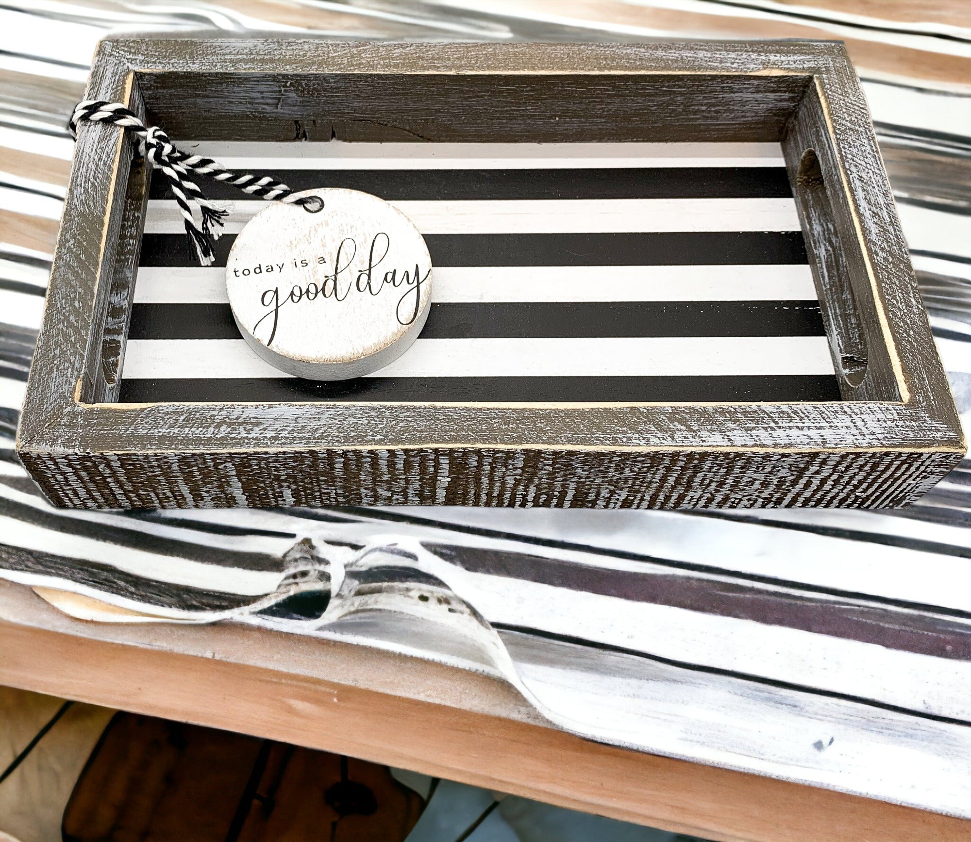 Good Day Stripes wooden tray featuring a black and white design with the phrase 'Today is a good day' on one side.