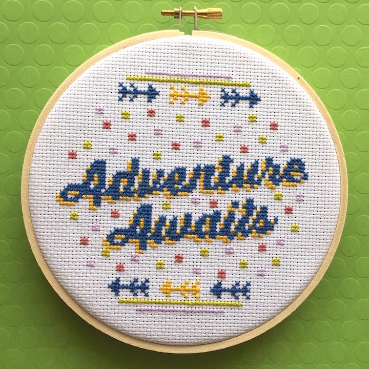 Adventure Awaits Counted Cross Stitch DIY Kit featuring elegant script design, includes all materials for crafting a 6-inch finished piece.