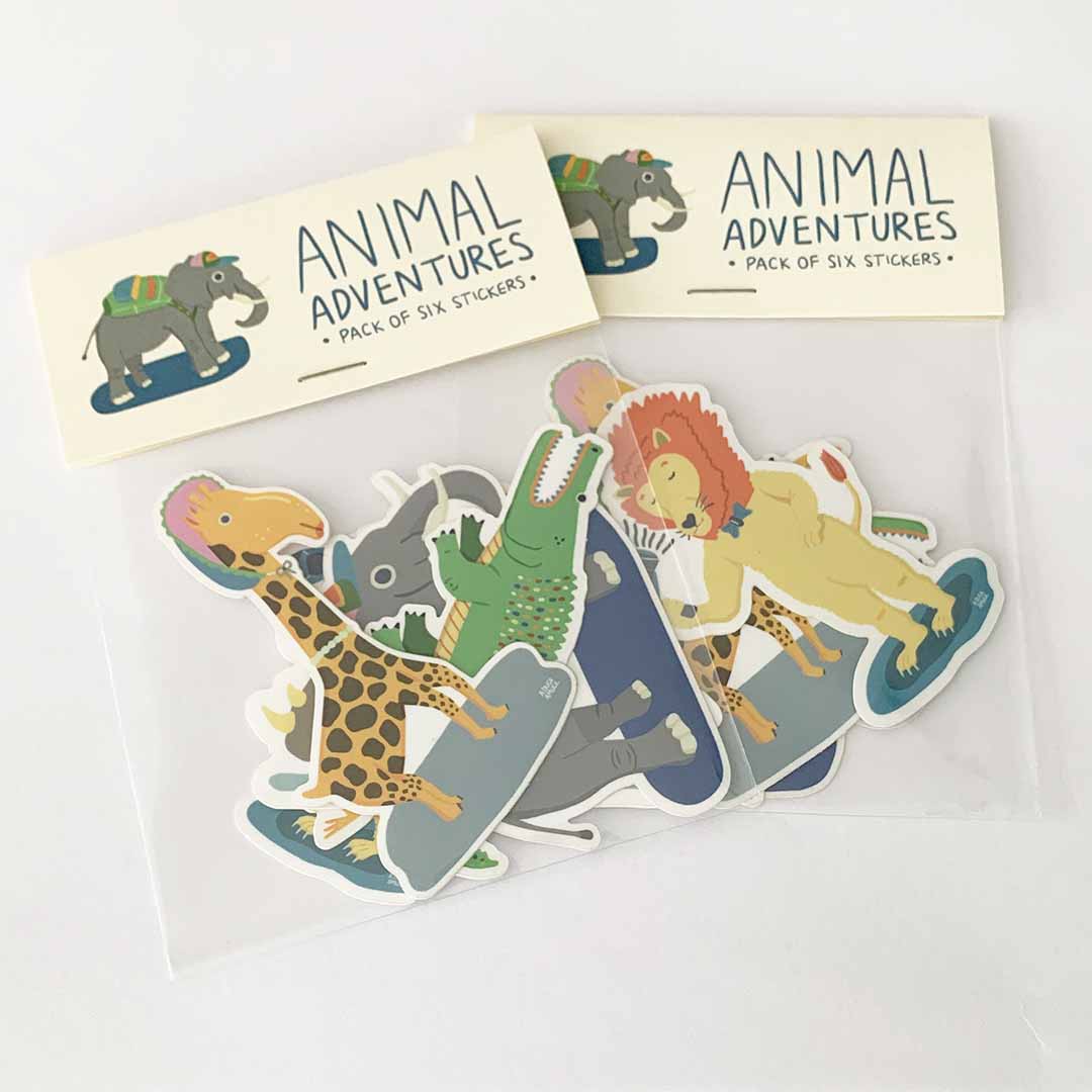 A colorful pack of six animal stickers featuring a lion, giraffe, alligator, rhinoceros, elephant, and heron, each measuring 2" x 3".