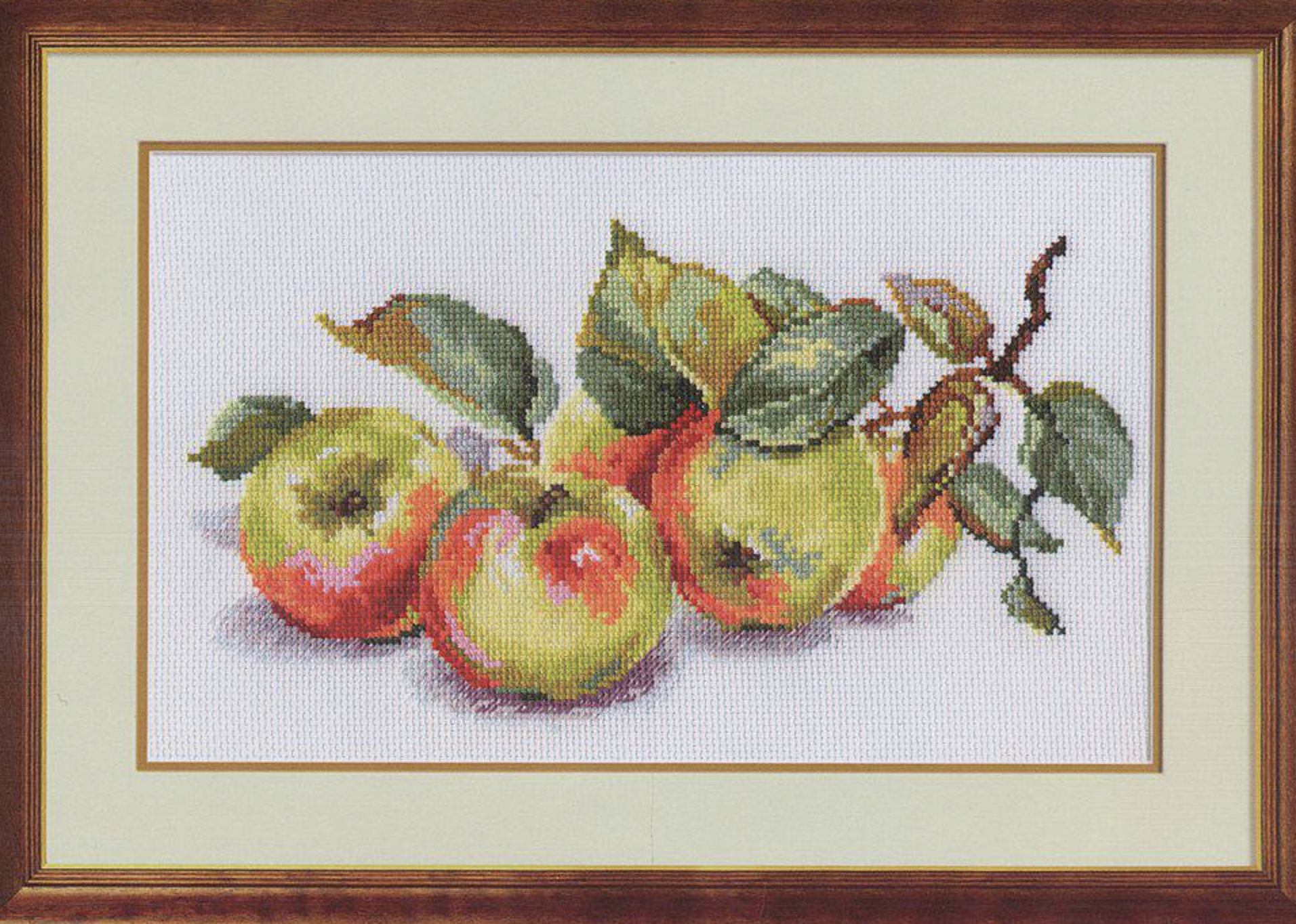 Apples 5-09 Cross-stitch kit with white aida fabric, colorful threads, and an embroidery needle.