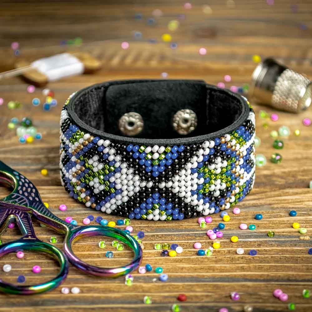 Bead embroidery kit on artificial leather FLBB-031, featuring colorful beads and materials for crafting unique bracelets.