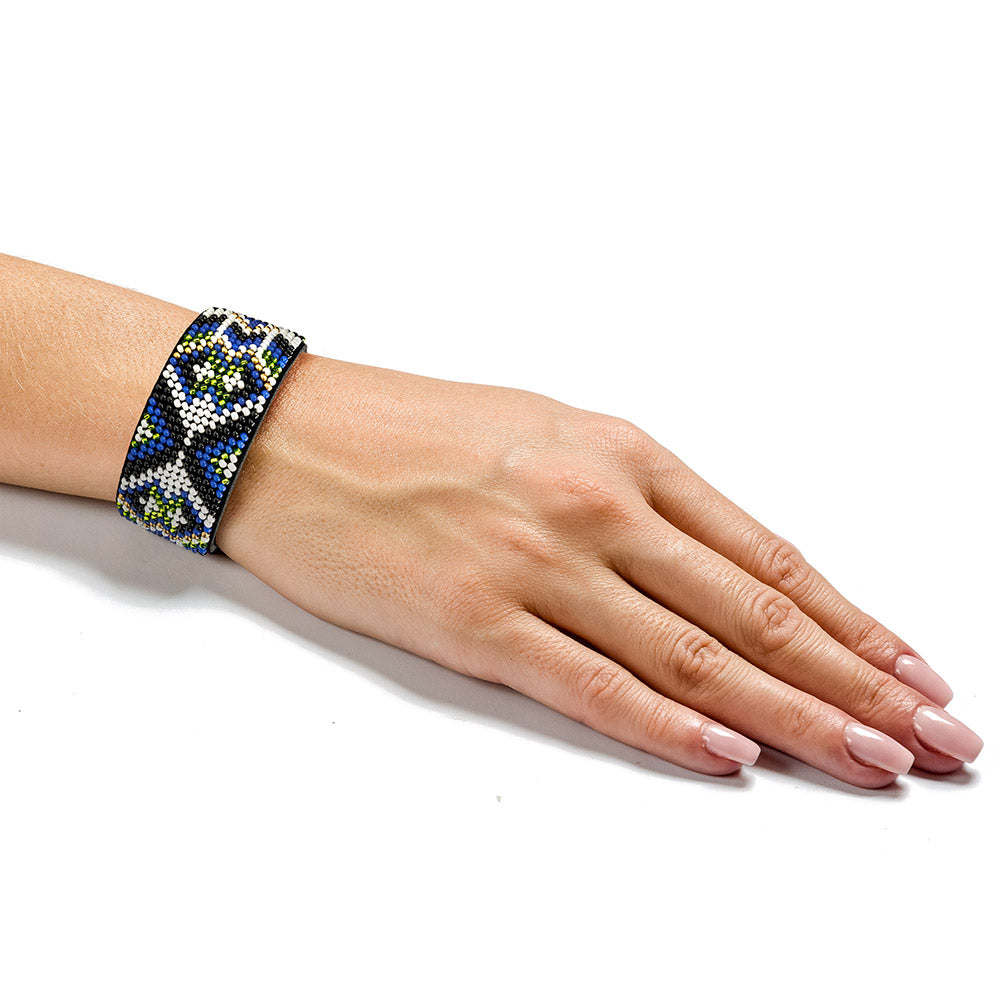 Bead embroidery kit on artificial leather FLBB-031, featuring colorful beads and materials for crafting unique bracelets.