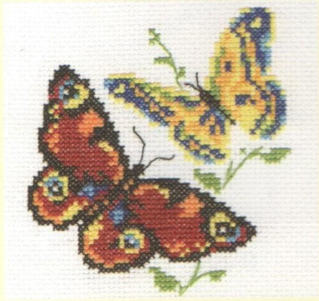 Beautiful Butterflies Cross-Stitch Kit featuring white aida fabric, colorful threads, and an embroidery needle.
