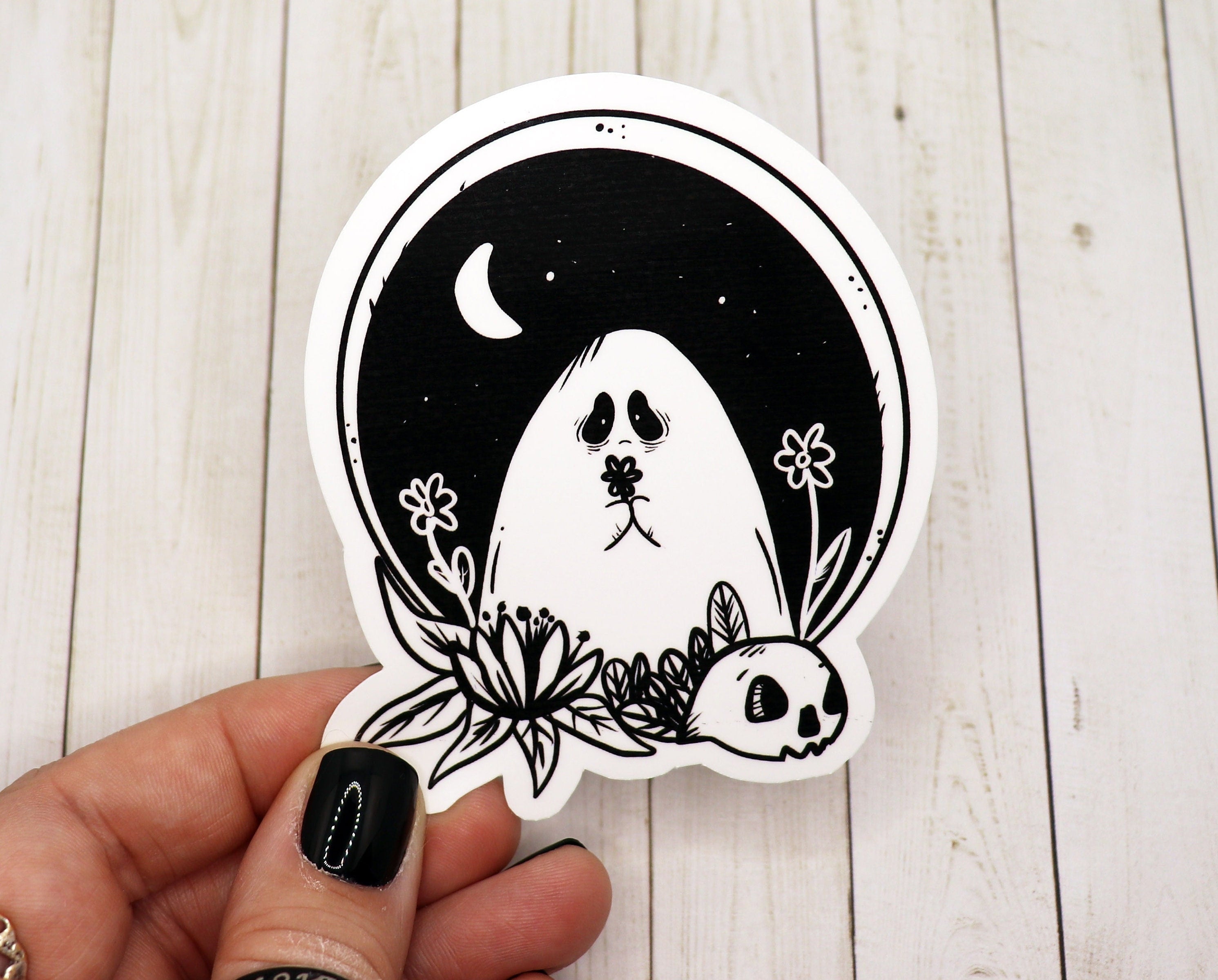 Black and white sad ghost sticker on a white background, featuring a whimsical ghost design with a melancholic expression.