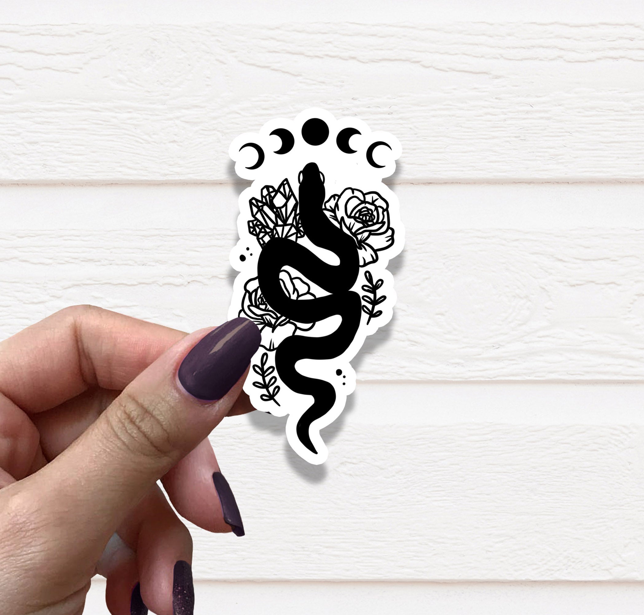Black and white vinyl sticker featuring a snake design, perfect for personalizing various items.