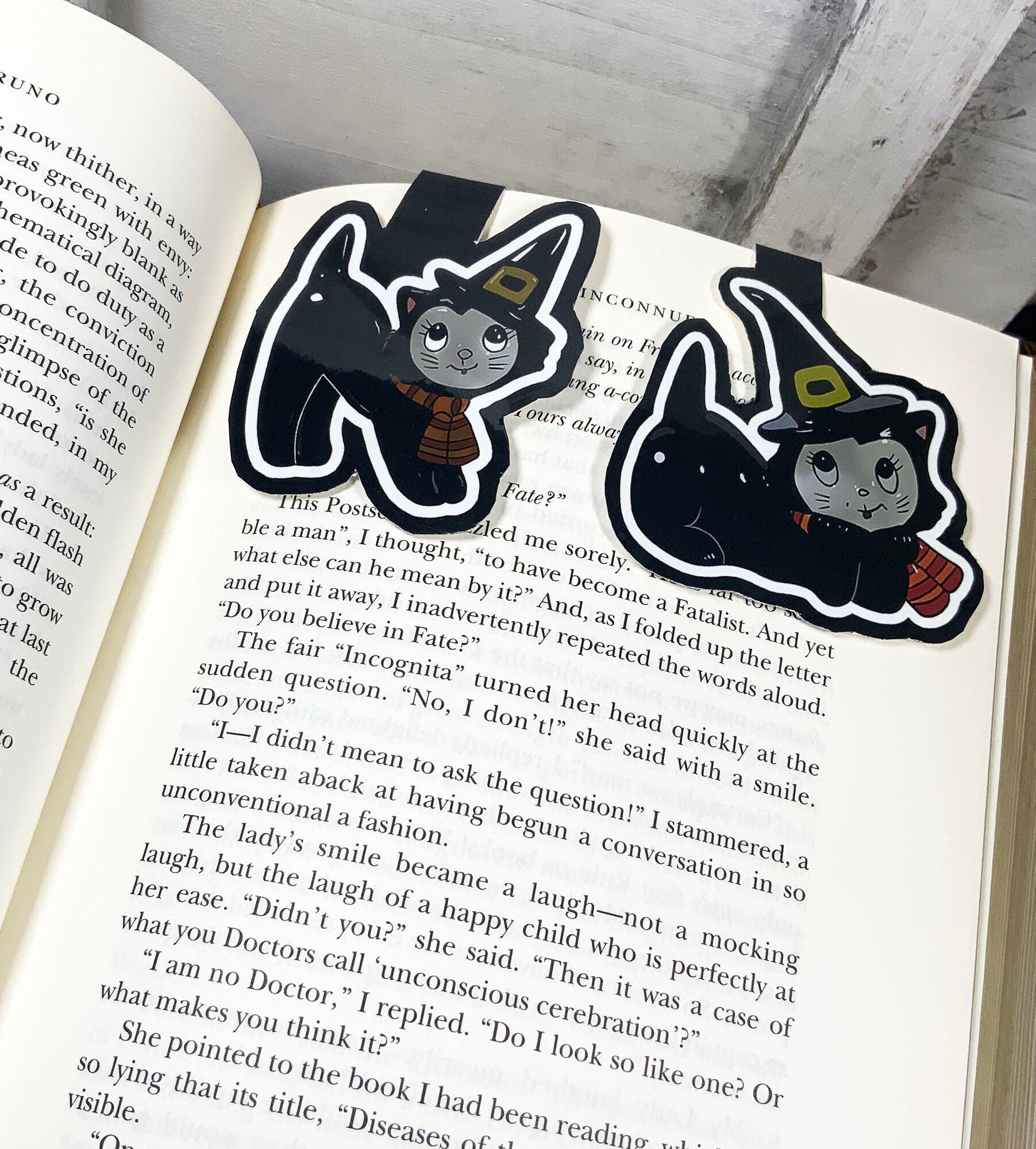 Black Cat Magnetic Bookmark Set featuring two double-sided bookmarks with strong magnets, designed for book lovers and cat enthusiasts.