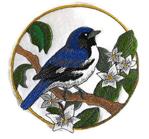 Black Throated Blue Warbler embroidered patch featuring vibrant colors and intricate mayflower details, perfect for iron-on or sew-on applications.